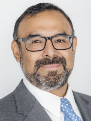 Headshot of Carlos Espinosa, Vice President, Marketing and Communications