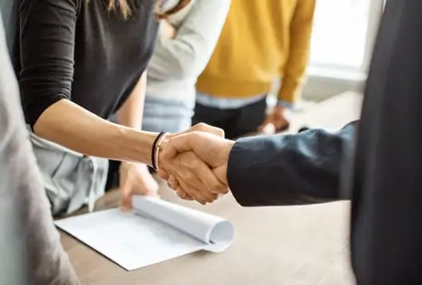 Two people shaking hands